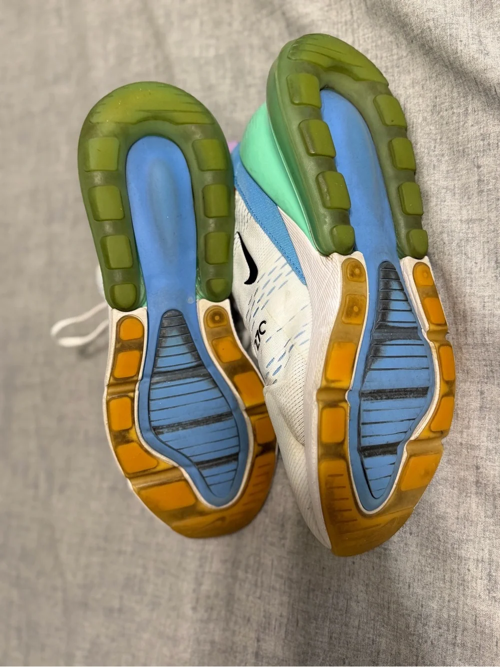 Nike White Running Sneakers with Orange Accents and Purple Lining